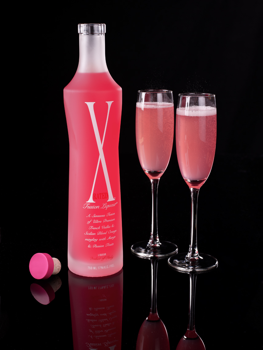 X Rated bottle with flutes of sparkling wine